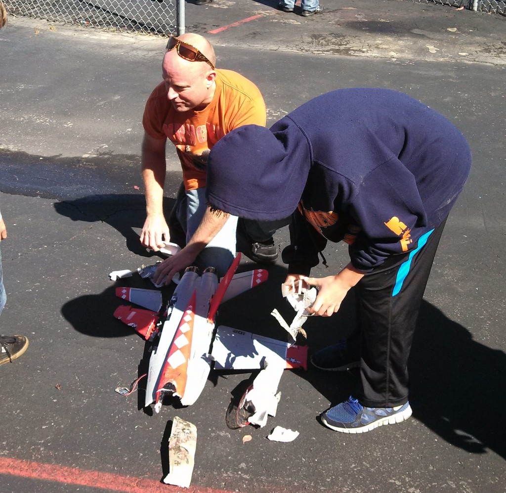 Chris helps Justin in the FAA recreation hangar...